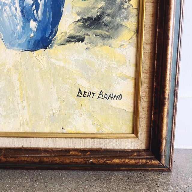 Vintage still life floral original oil painting in beautiful warm tones by artist “Bert Brand.” Framed in a wooden frame....