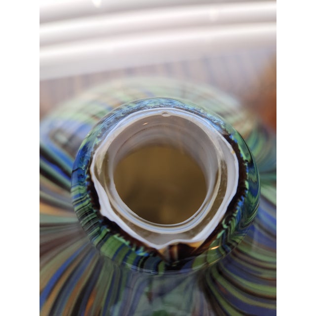 This stunning, hand-blown Attributed to Murano glass vase featuring the intricate Fenicio (Pulled Feather) technique. Is a...