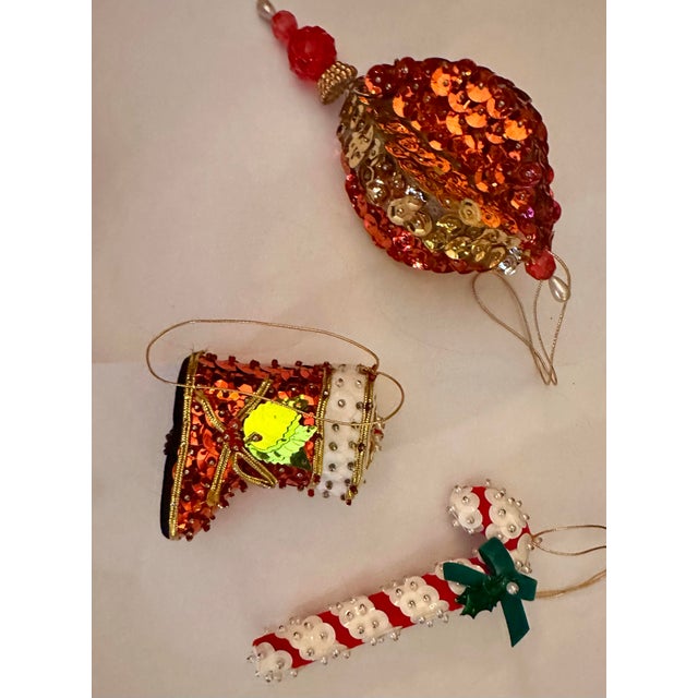 This is a stunning set of 13 vintage red fancy push pin beaded satin sequin handmade Christmas ornaments. The ornaments...