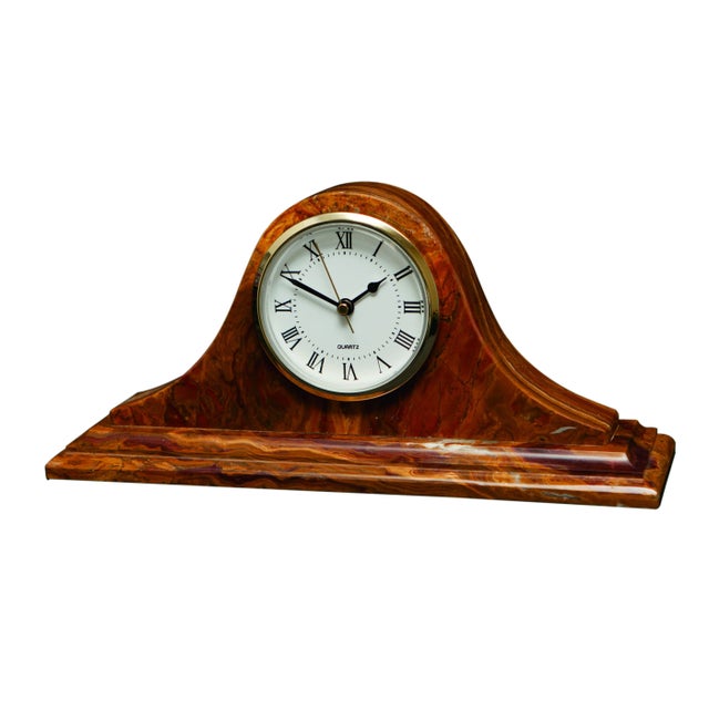 A Saturn Collection Saffron Brown Onyx Mantle Clock.