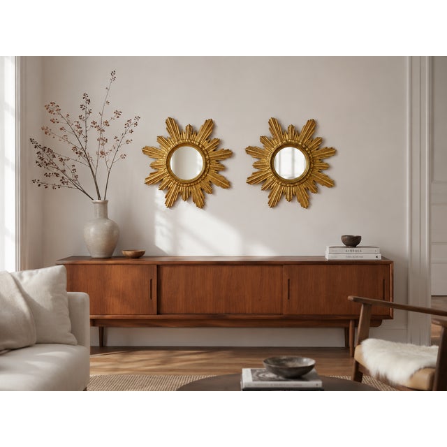 A beautiful pair of mid-century german sunburst mirrors manufactured by wenz, circa 1960. Each mirror features a finely...
