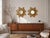 A beautiful pair of mid-century german sunburst mirrors manufactured by wenz, circa 1960. Each mirror features a finely...
