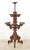 Antique Victorian large freestanding plant stand in dark wood tones, with fretwork detailing. Each tier can spin, and the...