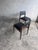 A refined pair of mid-century dining chairs featuring elegant solid wooden frames with traditional mortise-and-tenon...