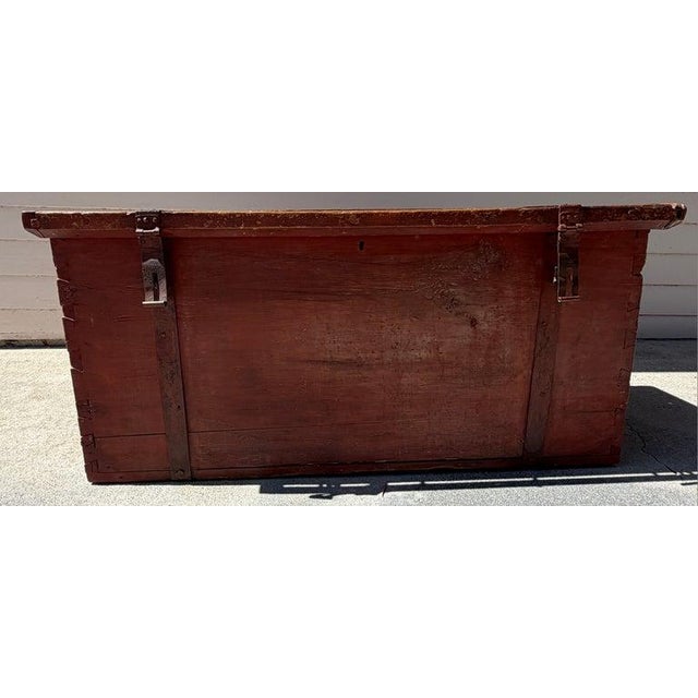 Early 19th century trunk with original hand forged hardware. Strap hinges are hand forged as well as handles.The trunk is...