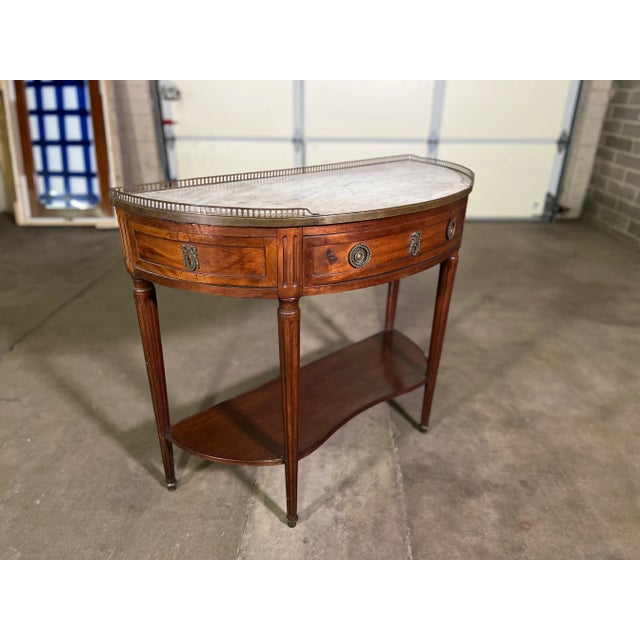 Very fine example of Louis XVI style. This is referred to as a dessert server, but it is really to be used as a console,...