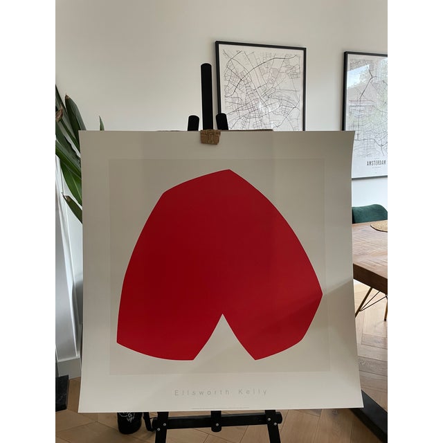 Experience the timeless elegance of Ellsworth Kelly's "Red White" (1962), a striking screen print that exemplifies the...