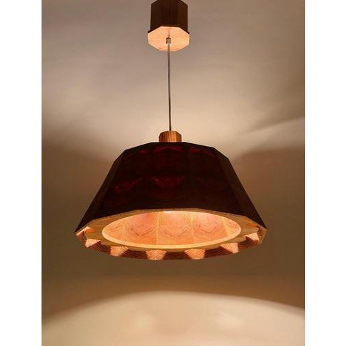 An exceptionally characterful Swedish wooden pendant light, dating to circa 1980 and bearing an incised signature reading...