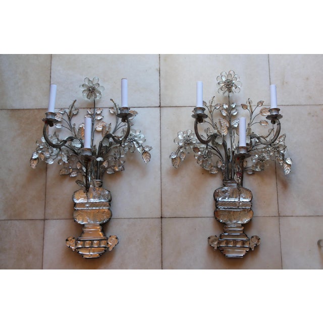 An exceptional monumental pair of Signed Maison Bagues France three-light wall sconces featuring magnificent hand-worked...