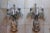 An exceptional monumental pair of Signed Maison Bagues France three-light wall sconces featuring magnificent hand-worked...
