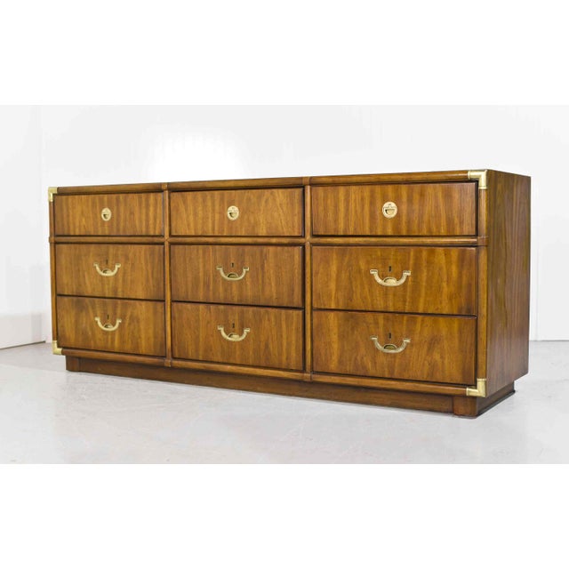 This 1970s Campaign 9 Drawer Dresser Accolade Collection by Drexel Furniture is an amazing addition to your decor. The...