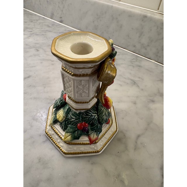 Sculpted fruit garlands, gold bows and trim. 5.5” H 4.5” Diameter. Holds a pillar or large votive. Rich hand painted details