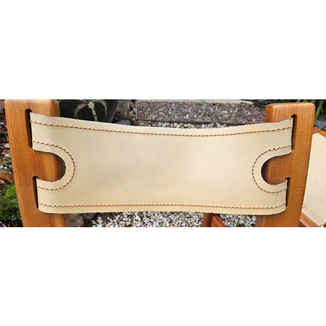 Small signs of use on the wood - fine scratches on the leather of the seat This piece has an attribution mark, I am sure...