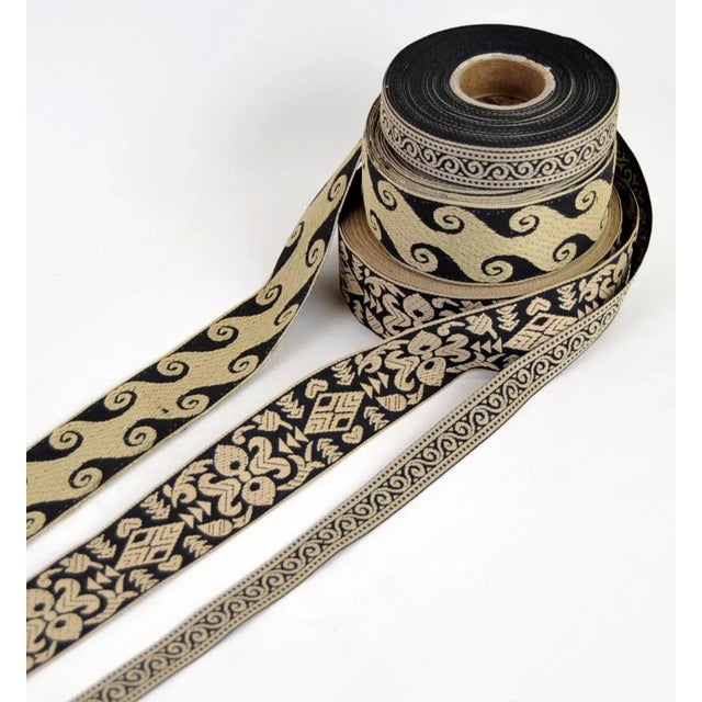 3 Vintage rolls of 'fingerinspire' jacquard embroidered trim ribbon. /the two wide rolls are 3/8" wide one contains 21...