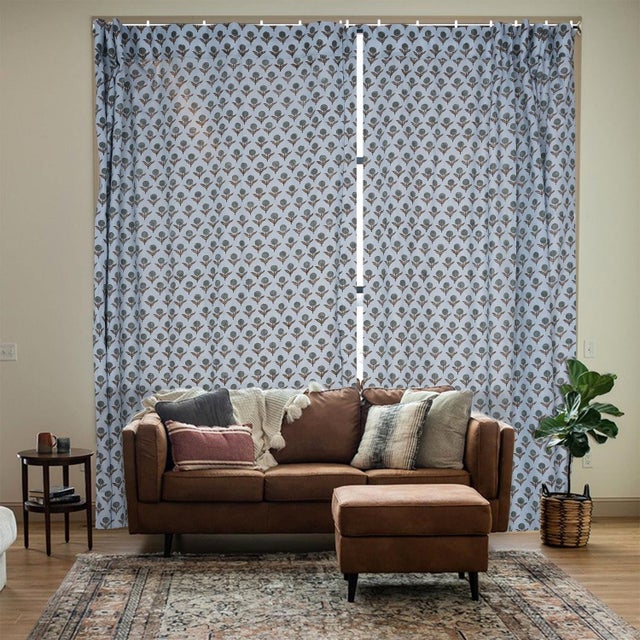 Elevate your home décor with this viscose colored linen block print ring curtain. Soft and breathable, it drapes...