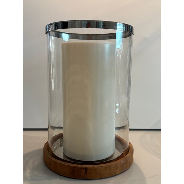 These are beautiful retired Arteriors Home Milena large glass hurricanes. These pieces feature a reclaimed teak wood base,...