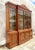 A stunning vintage Boho breakfront. Done in the Biedermeier style with Greek Key molding and leaded mullion glass doors....