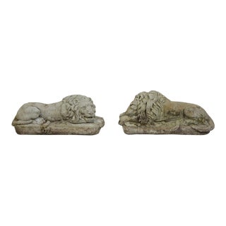 Pair of English 1920s Cast Stone Reclining Lion Sculptures on Conforming Bases For Sale