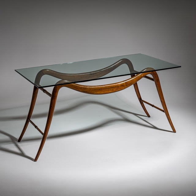 Elegant coffee table by Italian architect and designer Melchiorre Bega, dating from the 1940s. The gracefully curved...