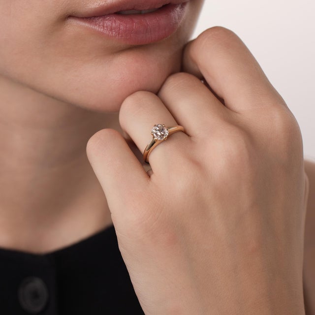 This beautiful Victorian diamond solitaire engagement ring is a timeless antique design from the 1900’s, centered by a...