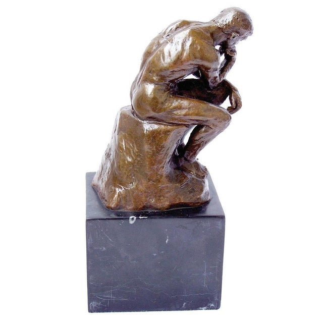 Modern brown patinated bronze sculpture representing The Thinker, 20th century. This bronze statue is a reproduction of...