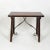Small-scale Spanish walnut trestle table with iron stretcher circa 1850 height: 24.5 in. (62 cm) width: 29 in. (74 cm)...