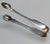 Fine antique George III sterling silver sugar tongs, hallmarked in Newcastle upon Tyne for the 1801-1802 assay year....
