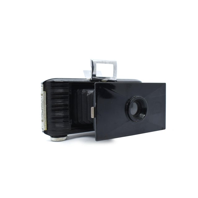 This charming Jiffy Kodak V.P. (Vest Pocket) folding camera is a quintessential piece of Art Deco design from the...