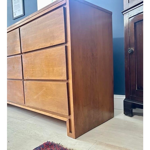 1950's triple dresser manufactured by the Conant Ball Furniture Co in Templeton, MA. Designed by Leslie Diamond. Made of...