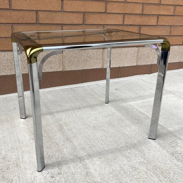 Nice chrome brass waterfall style side, end, or small coffee table, with beveled glass inset, manner of Widdicomb for...
