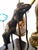 Mid 20th Century artist executed bronze of a female figure splayed on a chair. Mounted on a black stone base. Attributed...