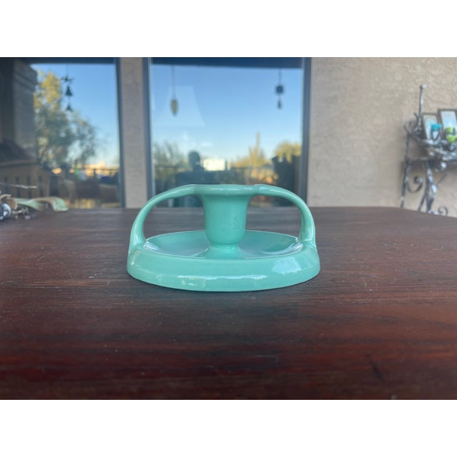 Here is a beautiful Mid Century Aqua Blue candlestick that works so well with Bauer and Catalina Pottery. It has the...