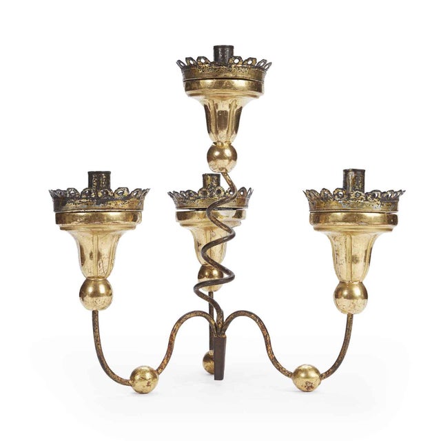 A pair of 18th-century four-branched table candelabras in gilded wood and iron, these two 18th-century candle holders...
