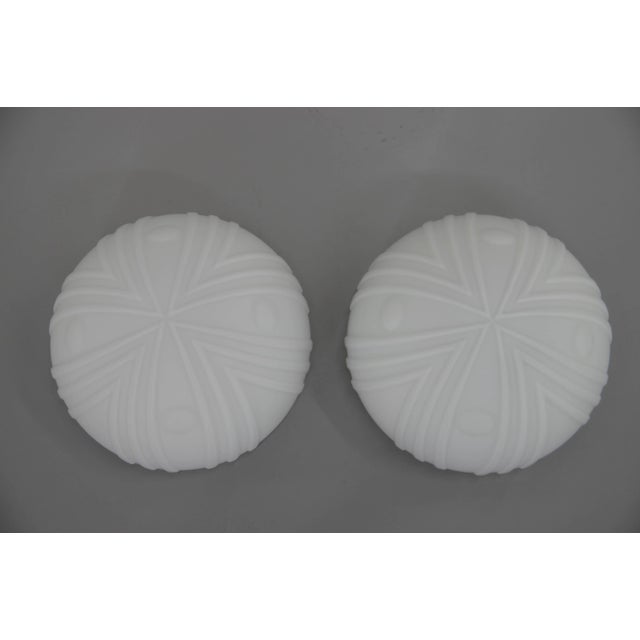 Set of two flush mount or wall lights. Black paint metal base and opaline glass shade. Very good original condition....