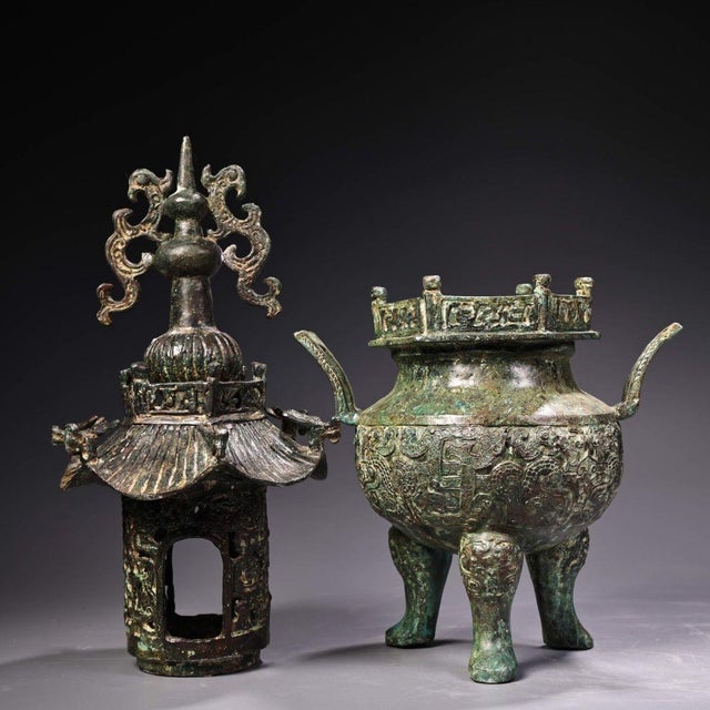 This striking antique bronze incense burner, or censer, features a unique, two-part design modeled as a pagoda or tower....
