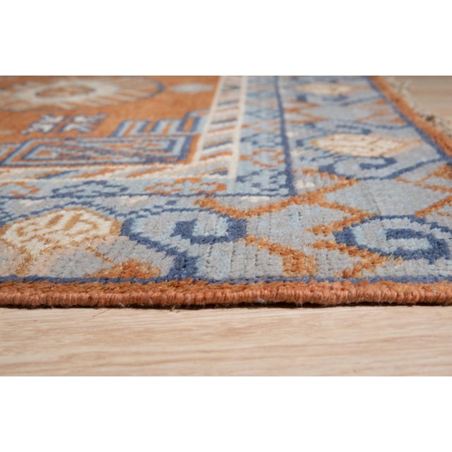 Jade Traditional Coral Hand Knotted Wool Rug, Country of Origin: India. This striking piece features a highly saturated...