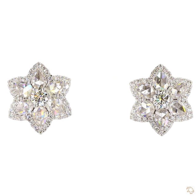 This set of earrings from our contemporary estate collection centers on a 2.5-carat diamond in a round brilliant cut for...