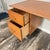 The desk’s versatility cannot be overstated. Whether serving as a writing desk in a den, a vanity in a bedroom, or a...