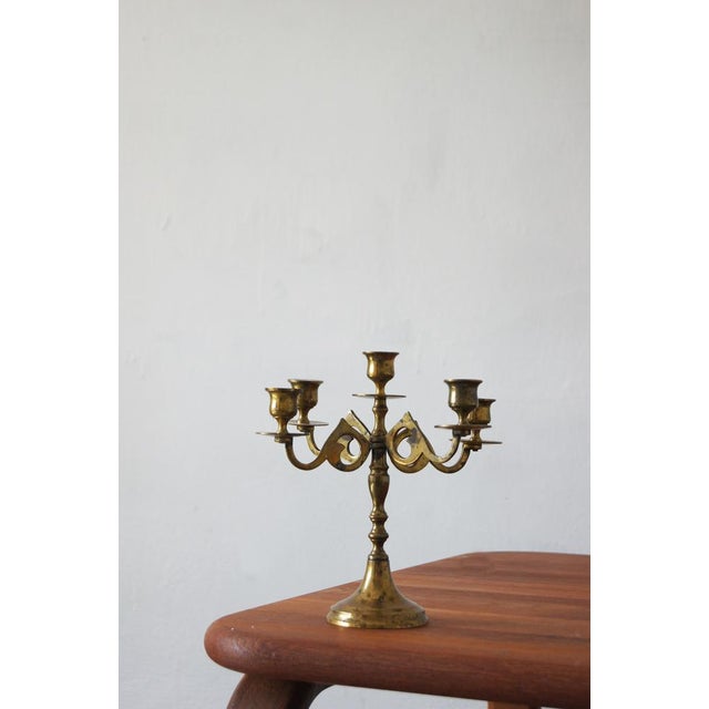 The candelabra was modeled on church chandeliers from the 18th century. The candelabra is designed to hold five candles....