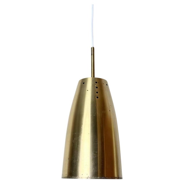 An exceptional series of ten architectural brass pendant lights, originally commissioned for ecclesiastical use, combining...