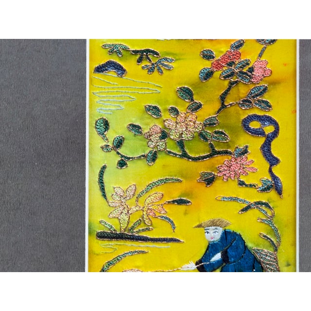 This exquisite vertical wall hanging features a vibrant silk embroidered panel set against a neutral matte, elegantly...