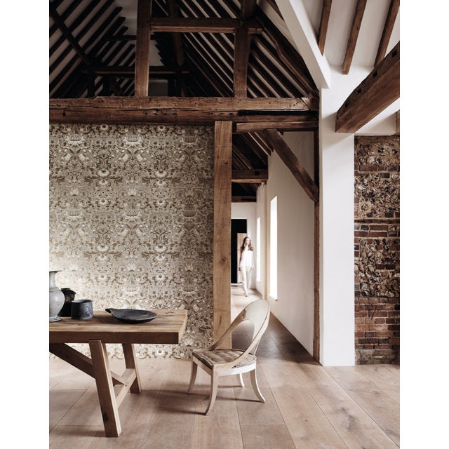 A contemporary large-scale wallpaper design simplified from the original Morris & Co. fabric designed in 1884. An...