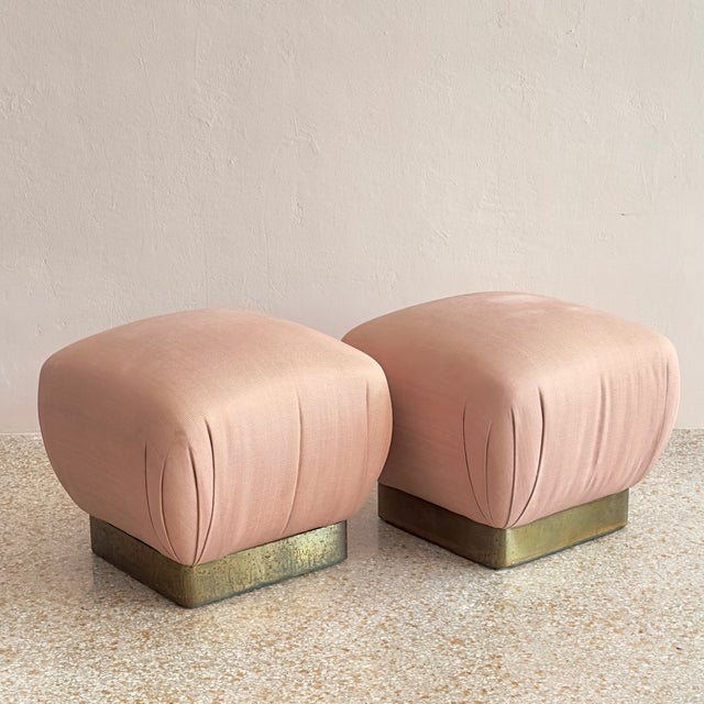 This stunning pair of vintage Hollywood Regency "Soufflé" pouf ottomans were designed and produced by iconic design house...