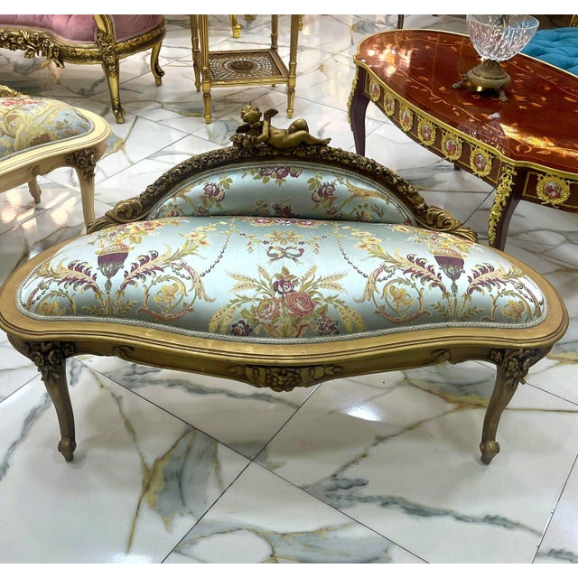 This exquisite antique French-style settee is a timeless statement piece, perfect for elegant interiors. Upholstered in...