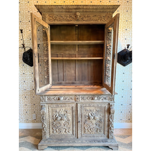 A handsome mid-19th century French Louis XIII style carved hunting buffet deux corps or bibliothèque de chasse, circa...