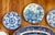 A striking and historic collection of English antique and mid-century decorative wall plates. 11 plates and bowls in total...