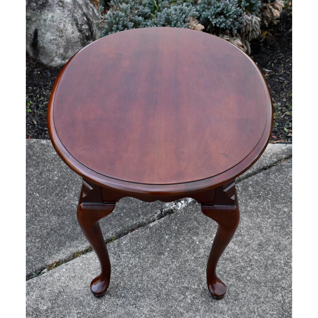 Vintage (1990's) Oval Side Table has a Queen Anne Style. Made by Thomasville. The Wood is CherryWood. The Measurements:...