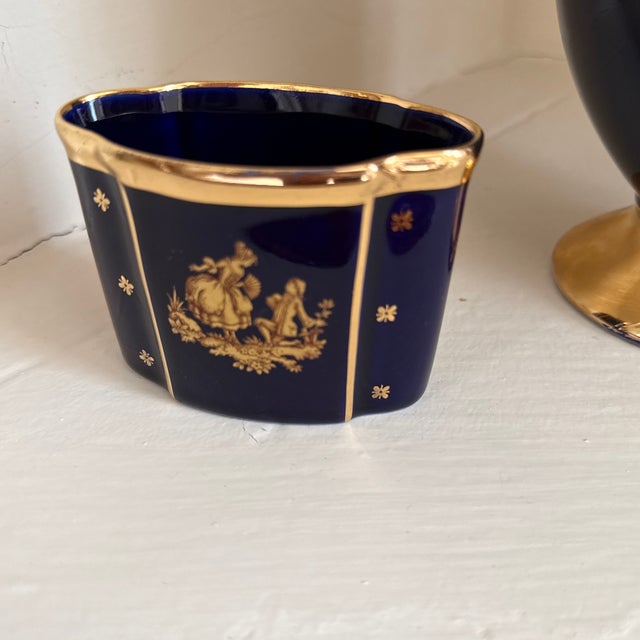 Limoges Castle vases. Has been in my family from purchase. Comes with vase and two canisters in photo
