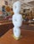 Elevate your space with this captivating biomorphic tabletop sculpture. Masterfully carved from white marble, the piece...