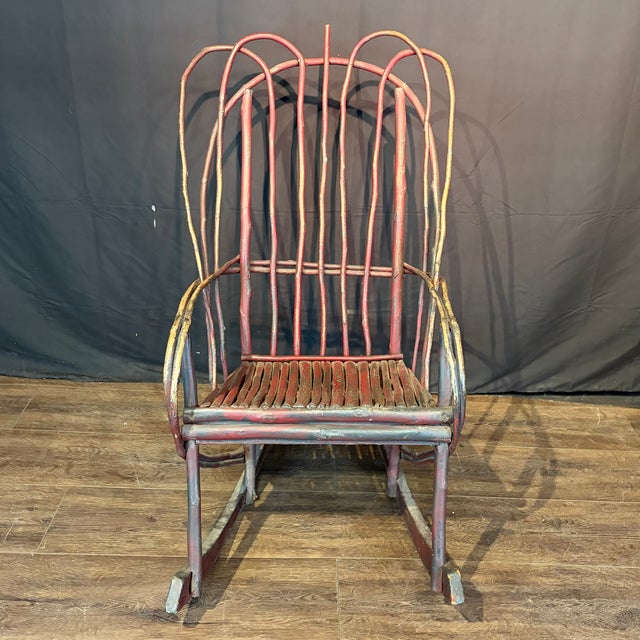 Pair of rustic Adirondack style bent twig rocking chairs from Maine, featuring original worn painted finish and high...